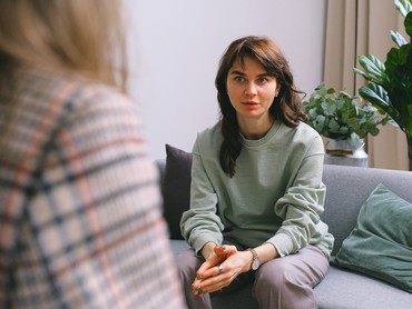 woman sitting in therapist's office