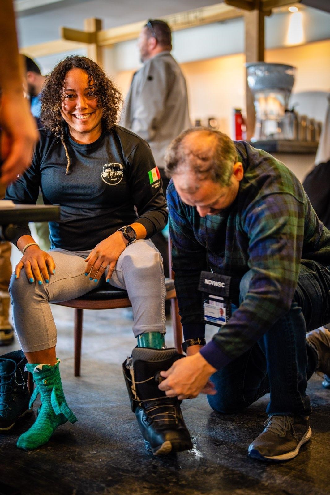 Frances Osorio-Rivera, US Army 2009-2013 gets fitted snowboard boot