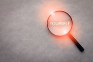 magnifying glass over the word "yourself"