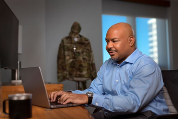 A Veteran accessing MyHealtheVet on his laptop