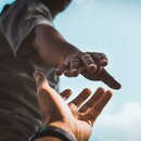 Hand reaching out for help