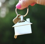 Woman holding house key