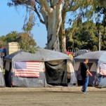 Homeless encampment with American flags