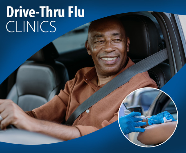 smiling man in vehicle waiting for flu vaccine