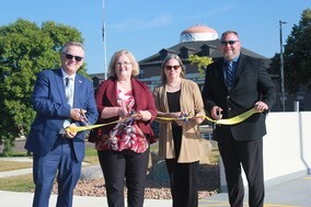 Dr. Brent Thelen, Cheryl Thieschafer, Breta Monroe, ; and Eric Blumke, cut the ceremonial ribbon
