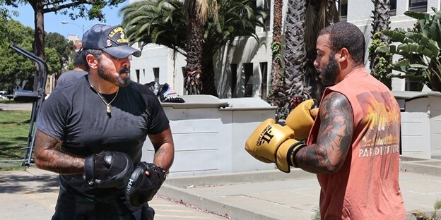 Veteran Bryan Aguirre (left) practices boxing drills with fellow Veteran Olivier Thony (right)