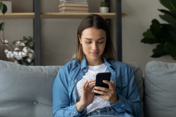  A Veteran checking her lab results on her phone at home