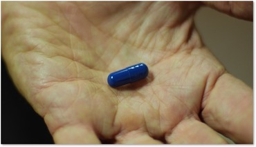 Pill in palm of hand