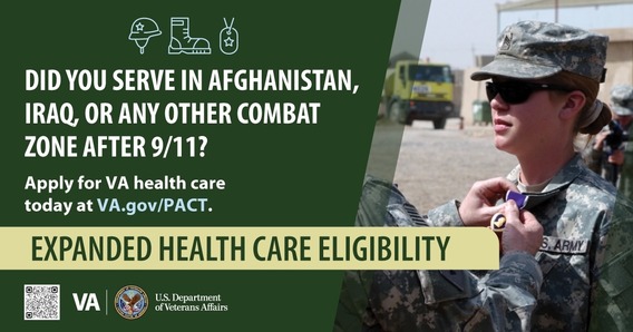 one soldier pinning purple heart to another soldier's collar