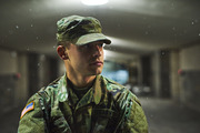 Soldier standing in a hallway