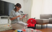 Woman holding Emergency Bag