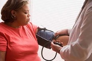 Women getting blood pressure check