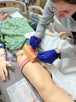 Nurse uses simulation manikin