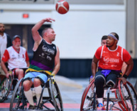 individuals playing wheelchair basketball 