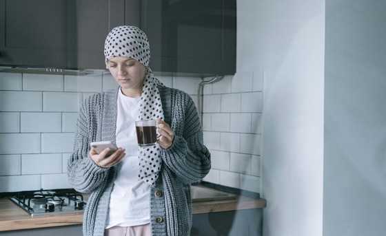 Women with Cancer holding phone