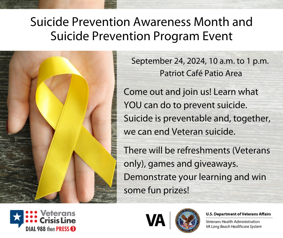 Hand holding yellow ribbon