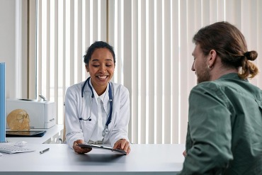 primary care doctor talking with patient