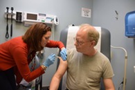 A person receives a vaccine.
