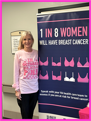 The author stands next to a breast cancer awareness banner that reads: 1 in 8 women will have breast cancer.