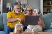 Couple using laptop