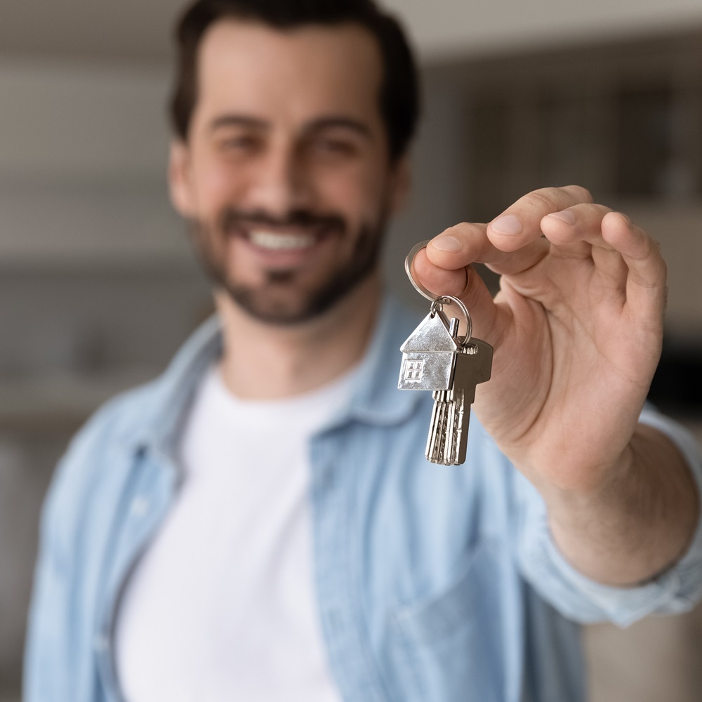 Man holding house keys