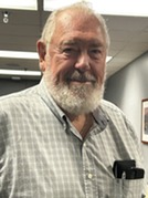 person with beard smiling