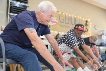 A group stretches while exercising.