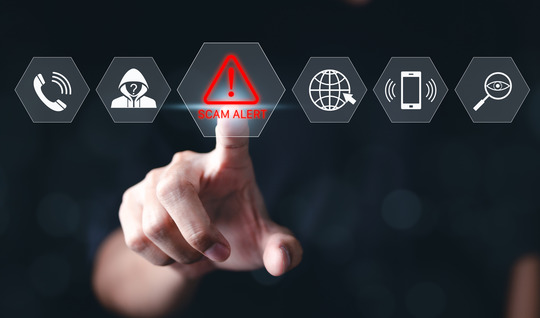 Man pointing and selecting scam alert