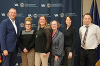 group standing with VA Secretary 