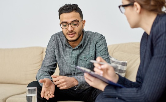Veteran and therapist talking together