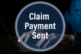 Hands typing on a laptop with a claim payment sent button on top.