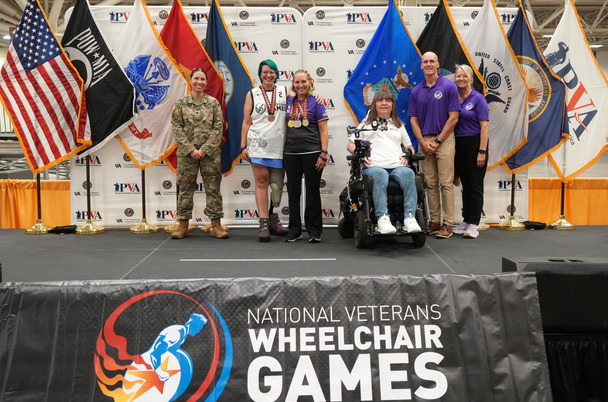 a group on award stag with flags 