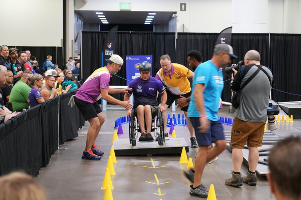 person in wheelchair completing an obstacle course