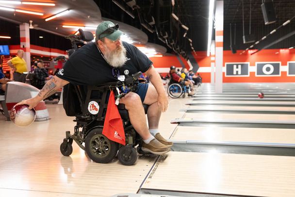 person in wheelchair bowling