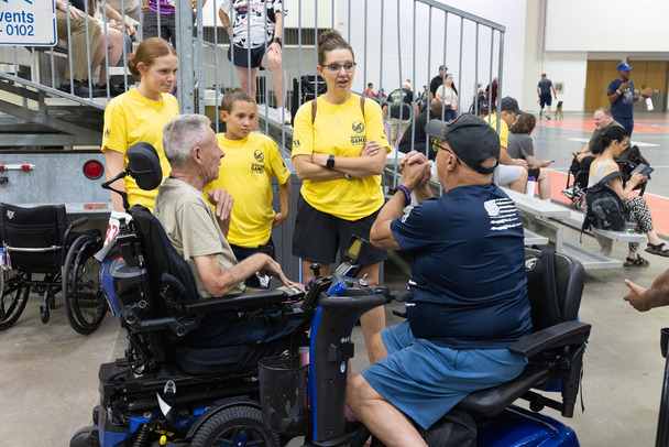 people in a group talking and smiling