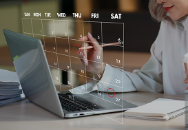 Woman on laptop with digital calendar.