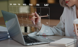 Woman on laptop with digital calendar.