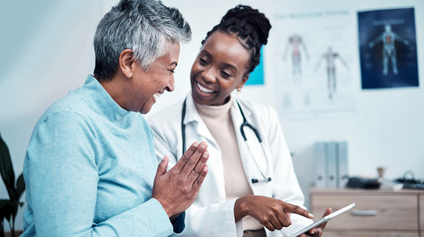 Doctor conversing with patient.