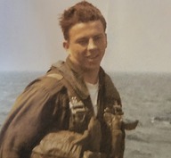 young man wearing a uniform on a Navy ship