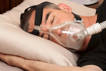 Man wearing a cpap mask to sleep