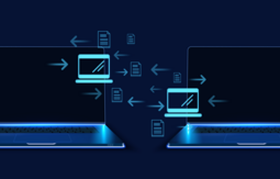two laptops exchanging information.
