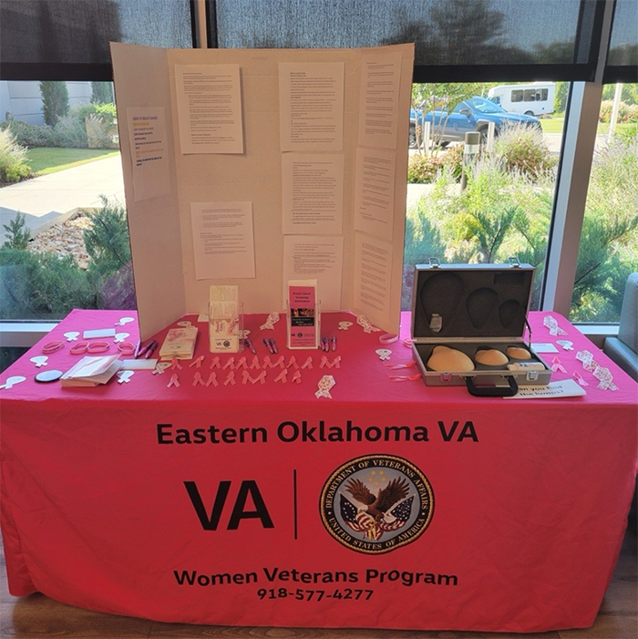 Eastern Oklahoma Women Veterans Program breast cancer awareness table display.