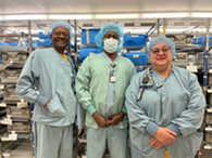 three people in light blue scrubs 