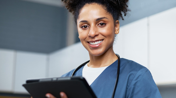 Nurse with tablet.