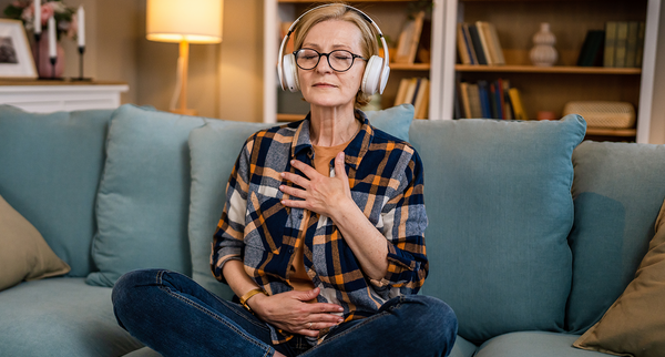 Woman practice guided meditation manifestation at home.