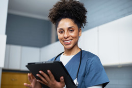 Nurse with tablet.