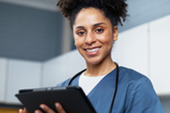 Nurse with tablet.
