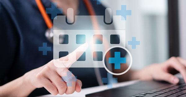 Medical worker pointing on digital calendar event appointment reminder.