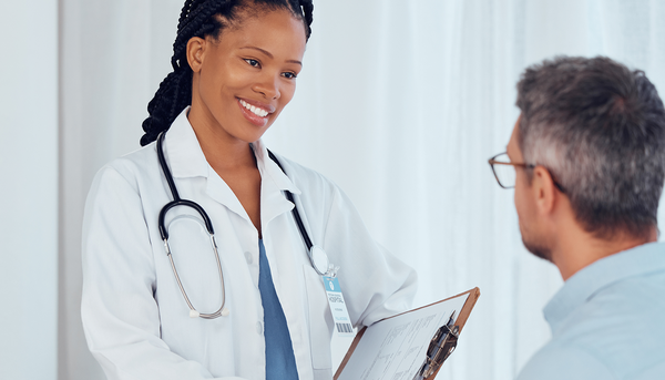 Doctor shaking hands with a man.