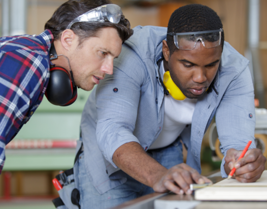 Two People measuring wood